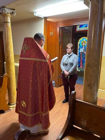 Fr. Joseph welcoming a new member to the Orthodox Faith.