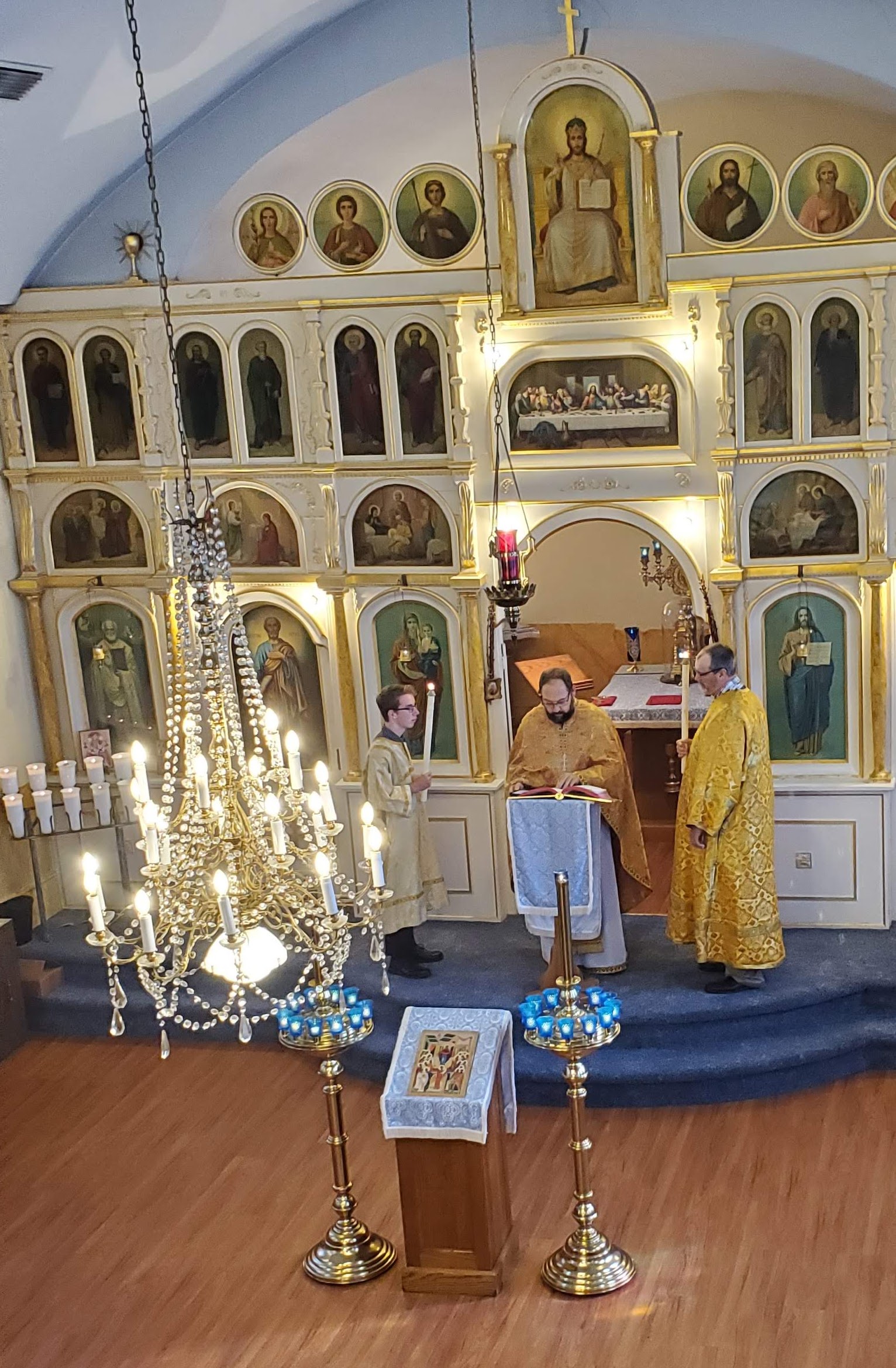 Orthodox priest reads from the Holy Gospel during Divine Liturgy