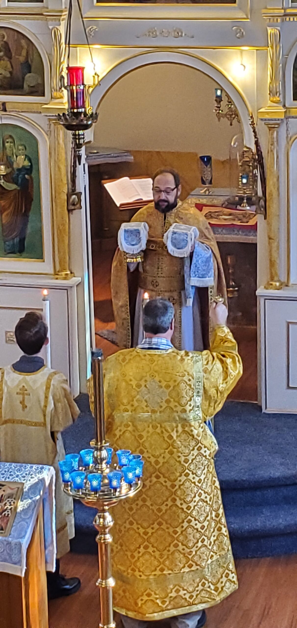 Orthodox priest prepares the Eucharist during Divine Liturgy